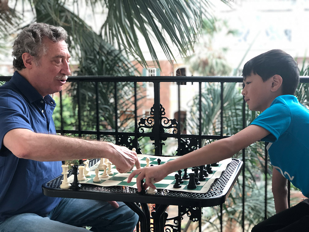 Oliver and his chess coach NM Bruce Pandolfini prepare before the next round of competition at the 2019 National Elementary (K-6) Championship in Nashville. May, 2019