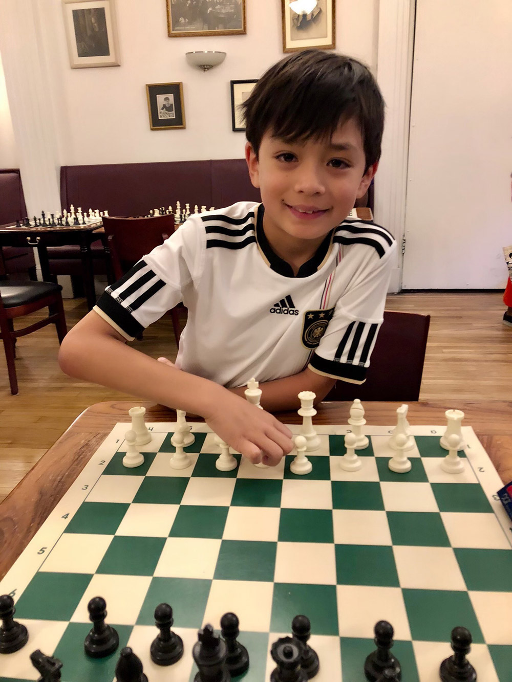 Oliver gets ready for some chess at the legendary Marshall Chess Club in New York City's Greenwich Village. May, 2018