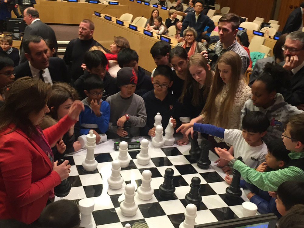 Oliver plays chess against GM Judit Polgar (Oliver is in white directly across from Judit) at the Global Chess Festival at the United Nations in NYC. March, 2017